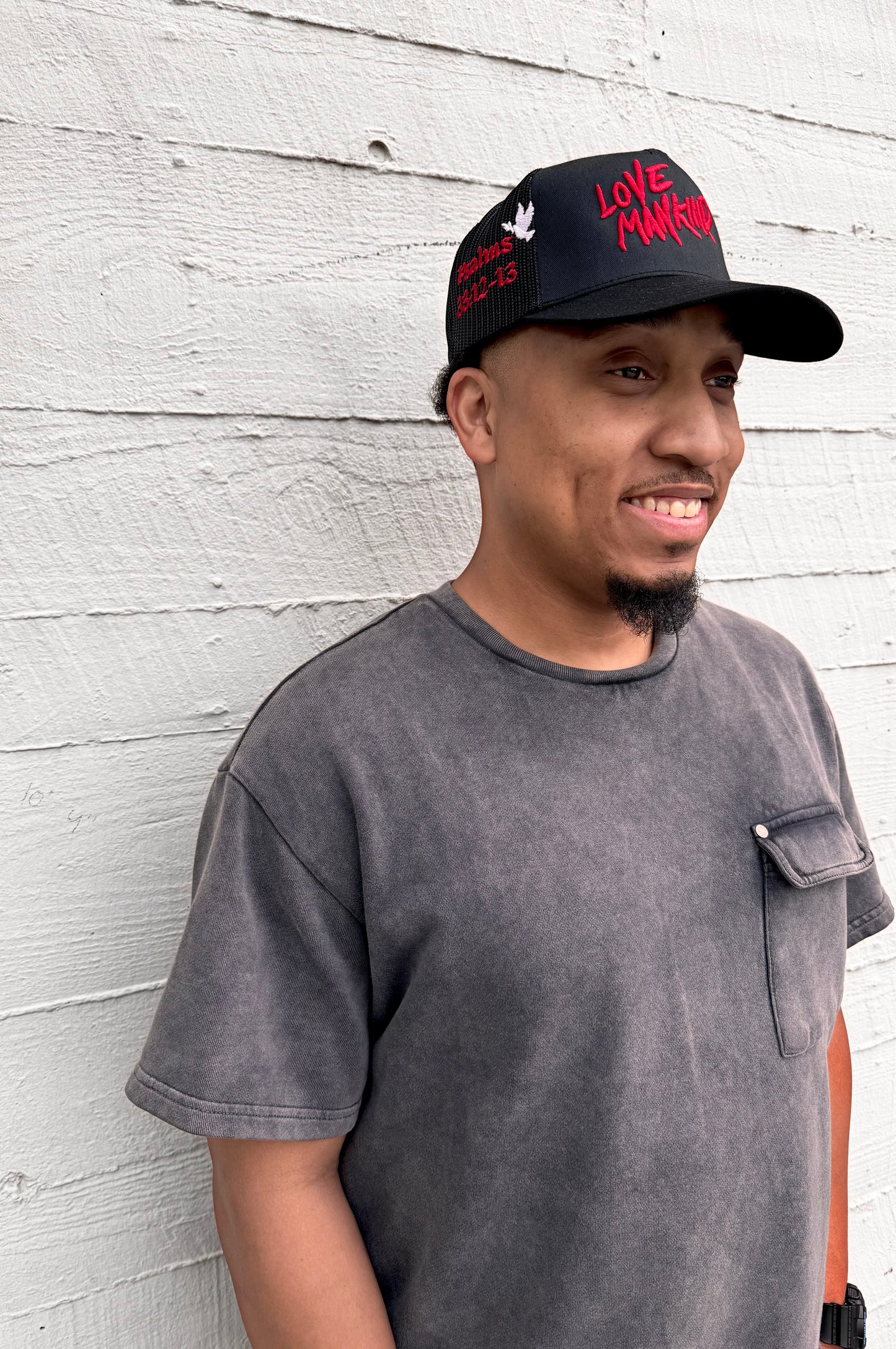 LOVE MANKIND SIGNATURE TRUCKER HAT