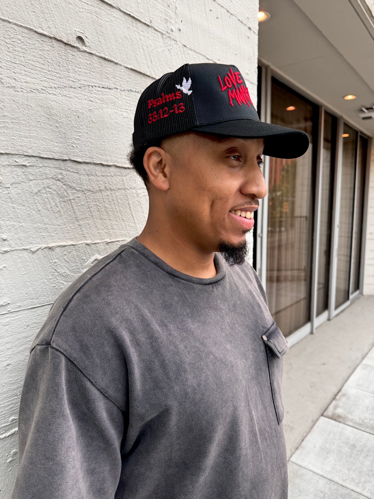 LOVE MANKIND SIGNATURE TRUCKER HAT